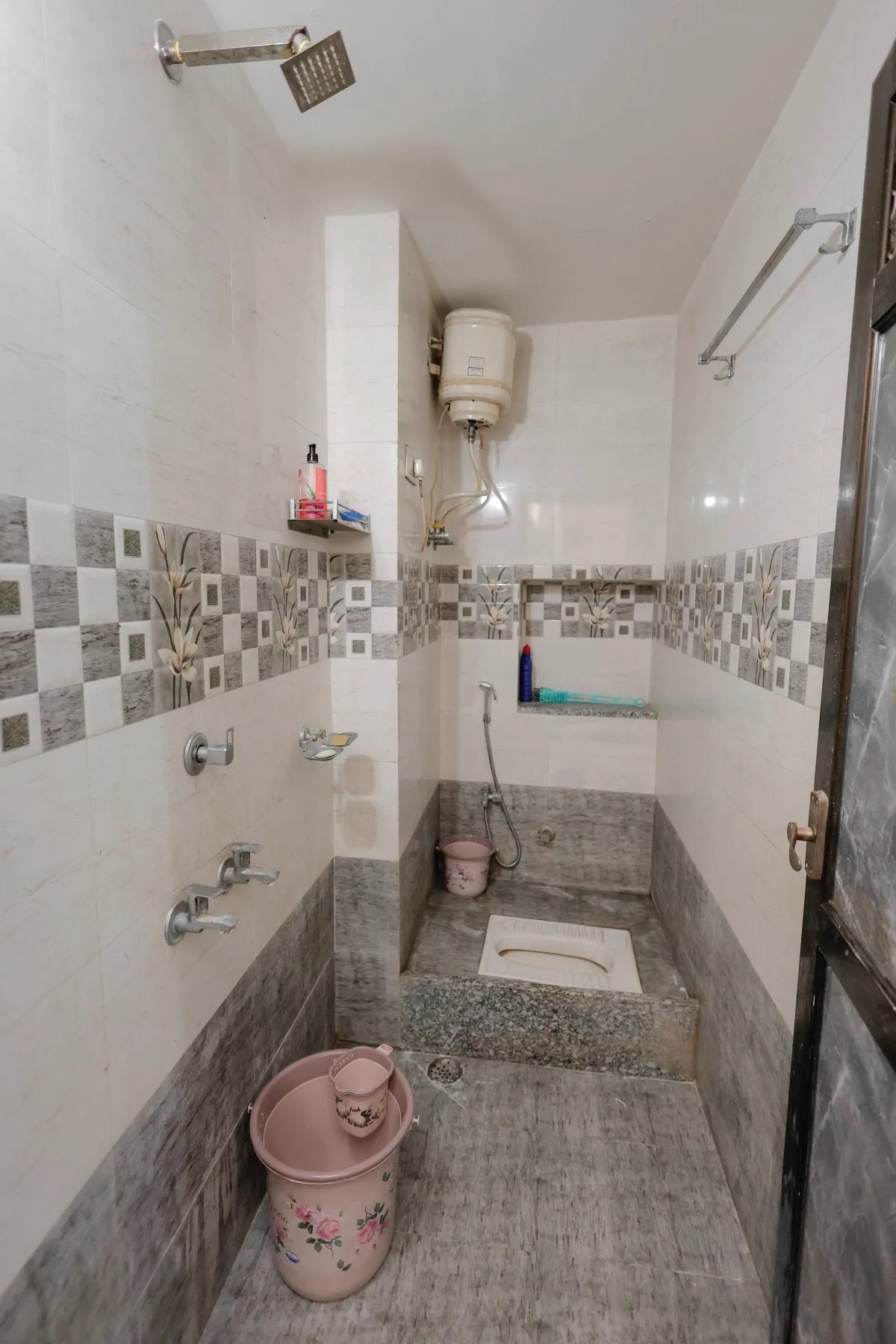 Clean modern tiled attached bathroom with hot water facility at The Jawai Niwas homestay