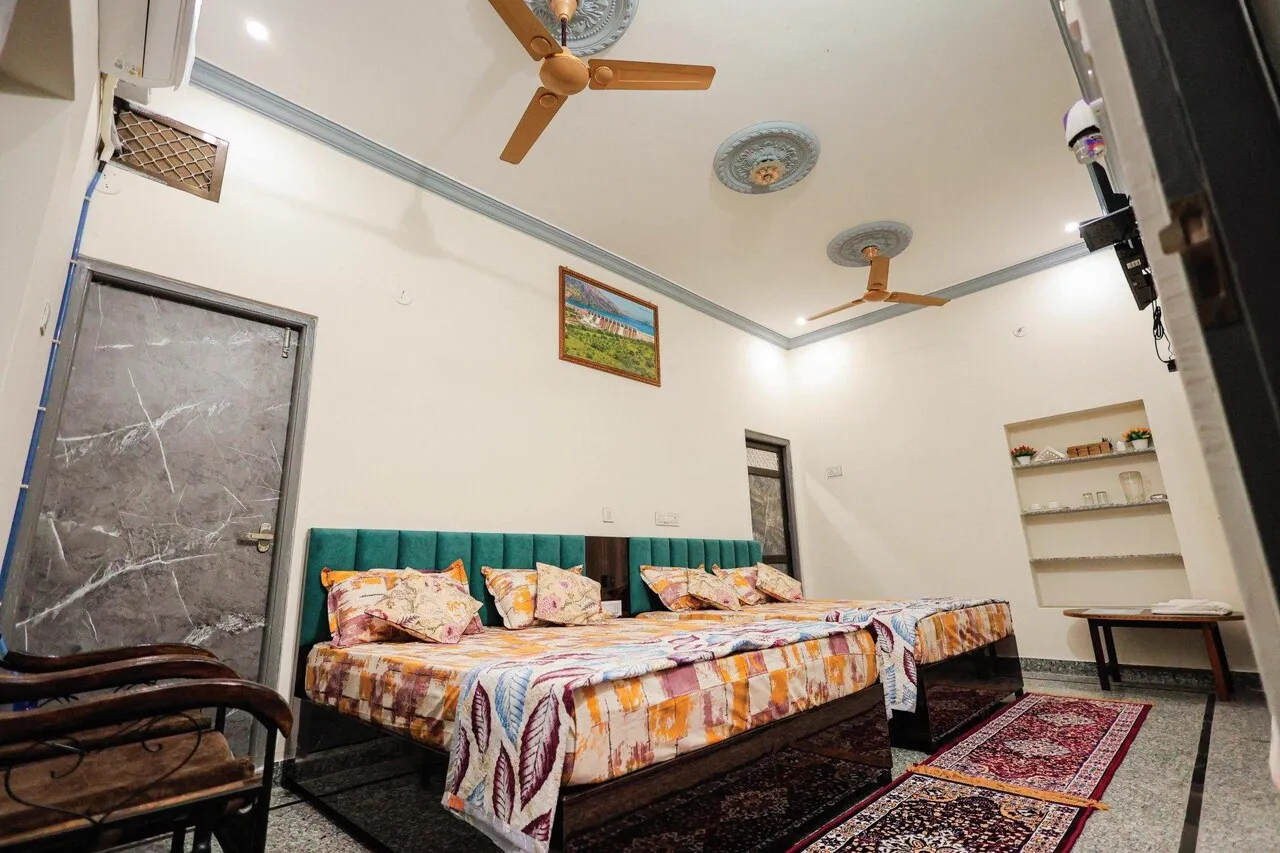 Deluxe AC room featuring two queen size beds and air conditioning at The Jawai Niwas homestay in Sumerpur