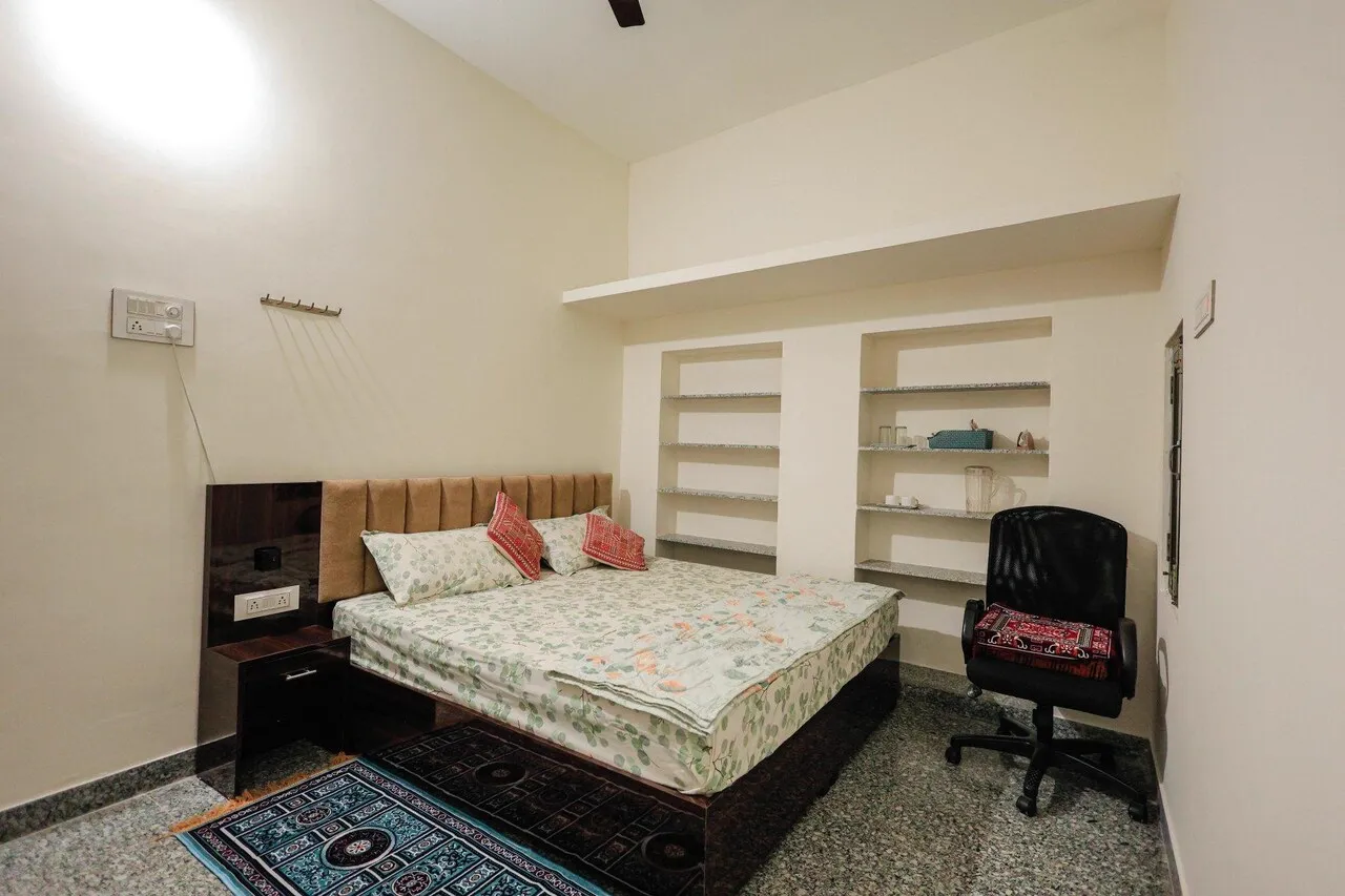 Deluxe Non-AC King Room with large king size bed and workspace table at The Jawai Niwas